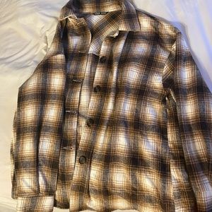 A plaid button up oversized shirt.